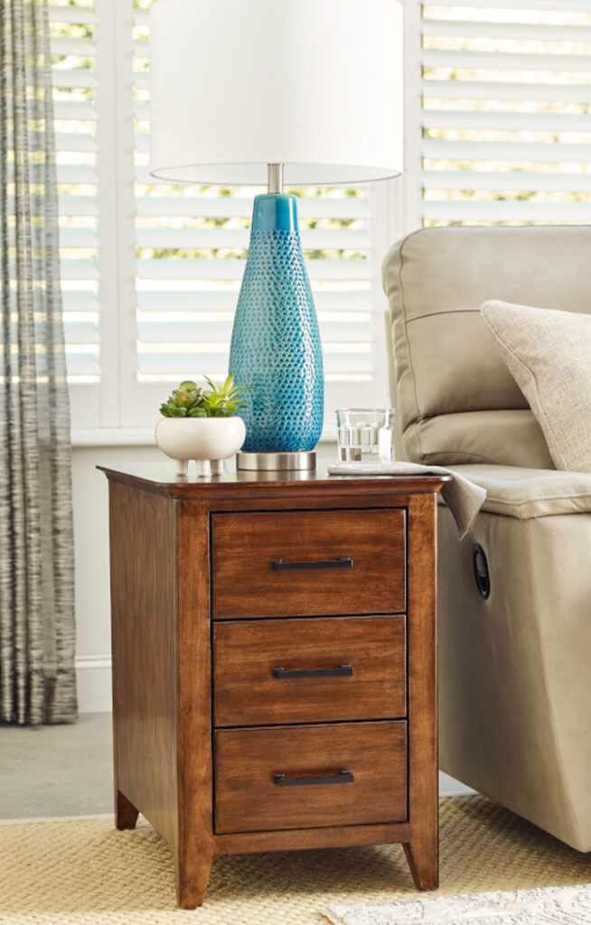 end table with a blue lamp on it